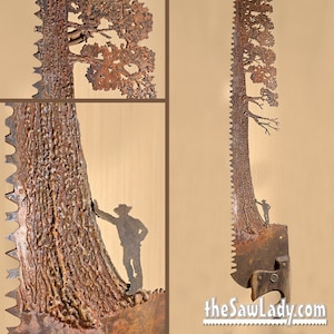 May include: A rusty metal saw blade has been transformed into a unique piece of art. The blade has been cut into the shape of a tall pine tree with a small figure standing at the base. The tree is detailed with branches and needles. The saw blade is mounted on a wooden base.