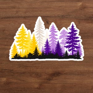 May include: A die-cut sticker featuring a forest landscape silhouette with a gradient color scheme. The trees transition from bright yellow on the left to white in the center, and then to shades of purple and deep violet on the right side.