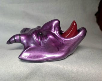 purple metallic color DEVIL / KRAMPUS ceramic bisque wall hanging with a red tongue