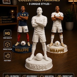 May include: Three collectible figurines of a football player named Mbappe, each standing on a circular base with the name Mbappe printed on the front. One figure is white, one wears a blue jersey, and one wears a white jersey. Each is 17cm tall.