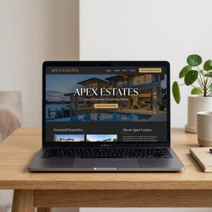 May include: A silver laptop displaying the Apex Estates website on its screen. The homepage features a large image of a modern waterfront house, the text Apex Estates, Luxury Properties, Discerning Clients, and a button labelled View Exclusive Homes.