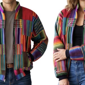 May include: A zip-up bomber jacket featuring a vibrant patchwork design of multicolored vertical stripes. The jacket has a stand-up collar, long sleeves with dark cuffs, and a quilted texture throughout, showcasing a variety of bright fabric panels.