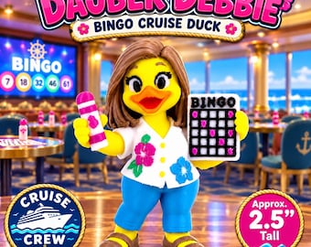 May include: A yellow duck figurine named Dauber Debbie, approximately 2.5 inches tall, wearing a white floral shirt and blue pants. The duck holds a pink bingo dauber and a bingo card. The text reads Dauber Debbie Bingo Cruise Duck.