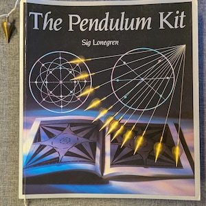May include: The Pendulum Kit by Sig Lonegren is a book featuring a black cover with white text, two circular geometric diagrams, and an illustration of a gold-colored metal pendulum swinging over an open book with star-shaped patterns.