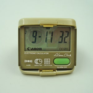 Vintage CANON CC-20 traveling  Calculator / World time clock / Alarm / Calendar
