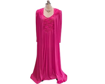 May include: A vibrant fuchsia-colored vintage nightgown and robe set. The nightgown features a lace bodice and a flowing skirt. The matching robe has long sleeves and a draped design. The set is displayed on a mannequin against a white background.