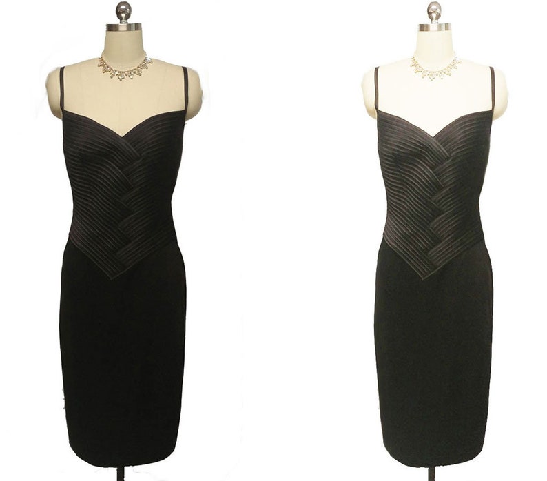 May include: A black sleeveless dress with a pleated bodice and a fitted skirt.
