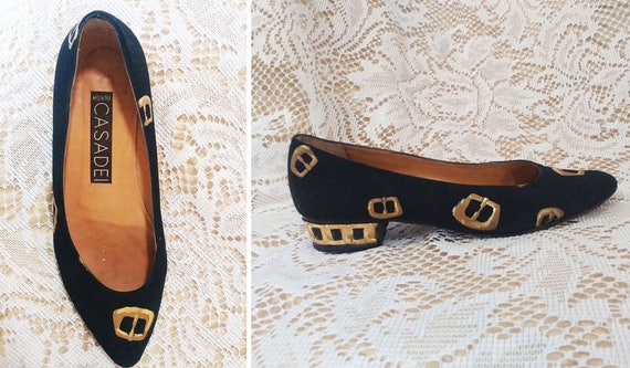 black flats with gold trim