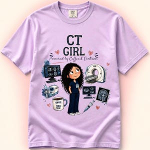 May include: A light purple t-shirt featuring a graphic of a cartoon character in dark blue scrubs surrounded by medical equipment including a CT scanner, computer monitors, a syringe, and a coffee mug with the text COFFEE FUELS FOCUS. The shirt text reads CT GIRL Powered by Coffee & Contrast.