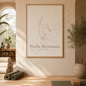May include: A rectangular wall art print in a light wood frame featuring a brown line drawing of a person in a Pincha Mayurasana yoga pose. The text reads YOGA ASANA SERIES, Pincha Mayurasana, and trust the ground you cannot see.