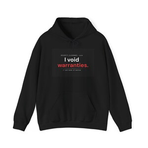 May include: A black long-sleeve hooded sweatshirt featuring a central graphic with the text SECURITY_CLEARANCE: none, I void warranties. in white and red, followed by // and terms of service in small white font on a dark rectangular background.