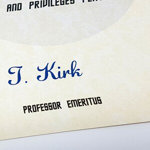 May include: A close-up of a document with the signature "James T. Kirk" and the title "Professor Emeritus".