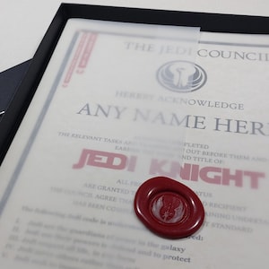 May include: A framed certificate with a red wax seal, proclaiming "The Jedi Council hereby acknowledge [ANY NAME HERE] as a Jedi Knight".