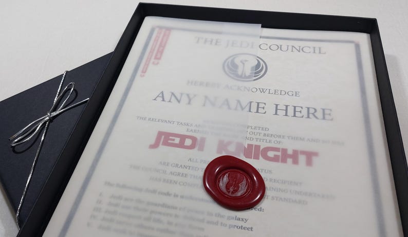 May include: A framed certificate with a red wax seal, proclaiming "The Jedi Council hereby acknowledge [ANY NAME HERE] as a Jedi Knight".