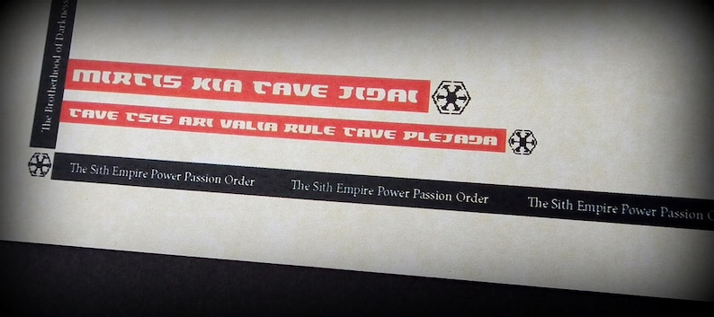 May include: A black and white image of a Star Wars themed sticker sheet. The sheet has a red and white stripe with the text "MIRTIS KIA CAVE JIDAL" and "CAVE TSIS ARI VALIA RULE CAVE PLEJADA". The sheet also has a black and white symbol of a star with a circle around it.