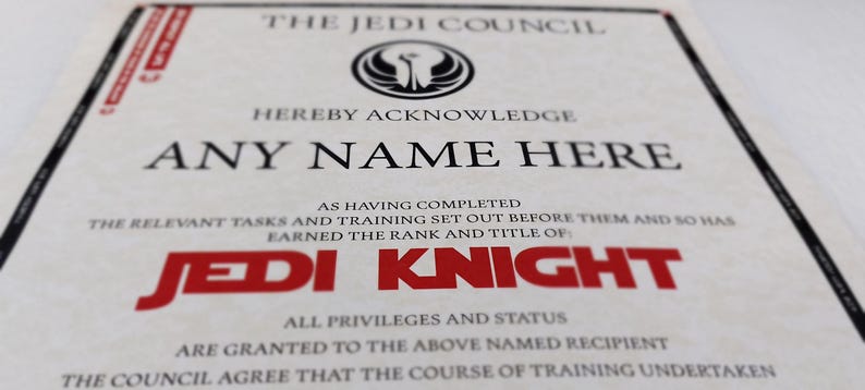 May include: A certificate from the Jedi Council, acknowledging that "ANY NAME HERE" has completed the relevant tasks and training, and has earned the rank and title of "JEDI KNIGHT".