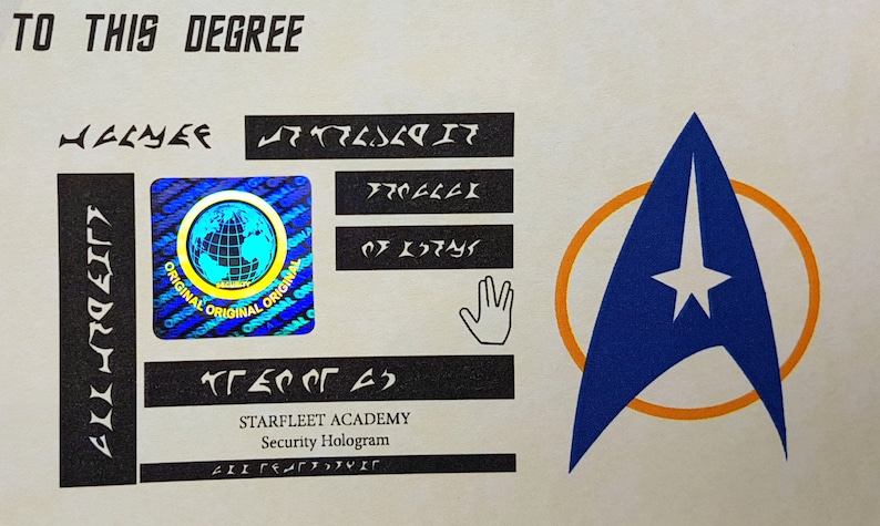 May include: A Starfleet Academy security hologram with a blue and orange Starfleet insignia, a holographic globe, and a hand symbol. The text "TO THIS DEGREE" is at the top of the hologram. The text "STARFLEET ACADEMY" and "Security Hologram" are at the bottom of the hologram.