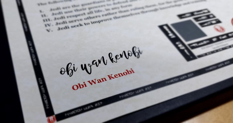 May include: A white piece of paper with black text that reads "The following are the guidelines to define... I. Jedi use their powers... II. Jedi respect all life... III. Jedi serve others rather than ruling through knowledge... IV. Jedi seek to improve themselves..." and a black and white image of a Jedi Knight. The text "obi wan kenobi" is written in black cursive and "Obi Wan Kenobi" is written in red below it.