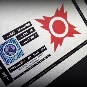 May include: A close-up of a printed card with a red starburst design and the text "Sith Lord Training Academy Security Holograph". The card also features a black and white globe graphic and the text "The Brotherhood of Darkness".