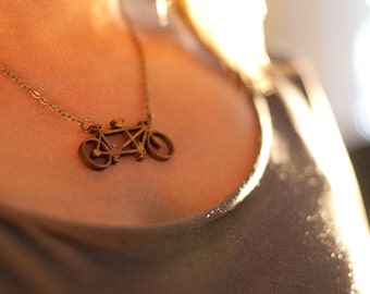 Tandem bicycle necklace made of laser-cut bamboo