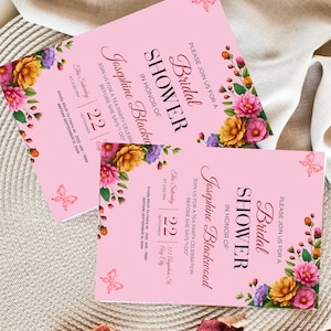 Luxury bridal shower invitation styled on textured fabric with vibrant garden inspired artwork and sophisticated keepsake presentation