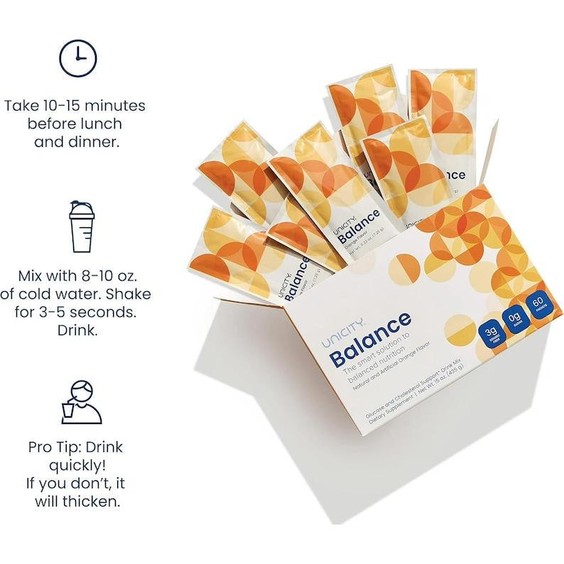 May include: A white box of Unicity Balance dietary supplement drink mix with orange and yellow circular patterns, containing multiple individual packets. Text includes instructions to take 10-15 minutes before meals, mix with 8-10 oz. of water, and drink quickly.
