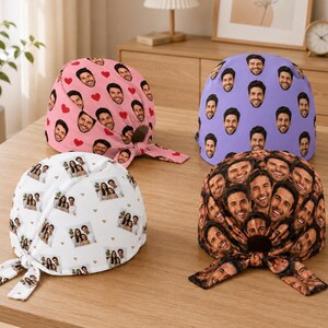 May include: Four scrub caps with custom photo prints. One is pink with red hearts, one is light purple, one is white with small heart accents, and one is a dense collage of faces. Each cap features tie-back straps for a secure, adjustable fit.