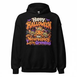 May include: A black hooded sweatshirt featuring a colourful graphic print with the text Happy Halloween You Neurospicy Little Gremlins. The design includes three green creatures, orange jack-o'-lanterns, purple bats, and spiderwebs.