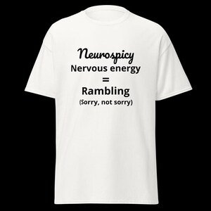 May include: A white short-sleeved t-shirt featuring black text that reads: Neurospicy, Nervous energy = Rambling, (Sorry, not sorry). The shirt has a crew neckline and a standard fit, displaying the printed graphic clearly on the front centre.