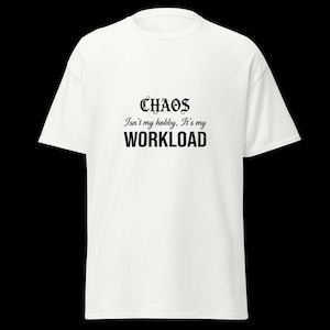 May include: A white short-sleeved t-shirt featuring black text printed on the chest. The text reads: CHAOS Isn't my hobby, It's my WORKLOAD. The shirt has a crew neckline and a standard fit, providing a clean and simple appearance for daily wear.