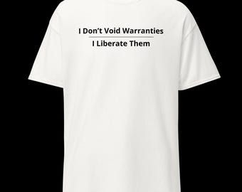 May include: A white short-sleeved t-shirt featuring black text printed on the chest that reads, I Don't Void Warranties, with a horizontal line underneath, followed by the text, I Liberate Them, in a clean, sans-serif font style.
