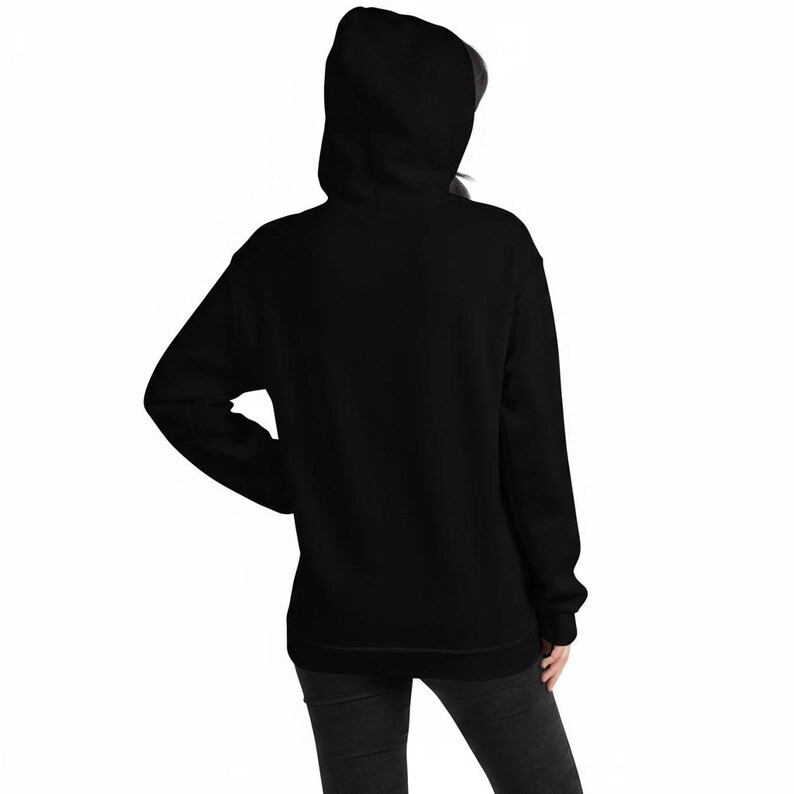 May include: A solid black long-sleeve hooded sweatshirt featuring a hood, long sleeves with ribbed cuffs, and a straight hemline. The garment is shown from the back, displaying a plain, unpatterned black fabric construction throughout the entire piece.