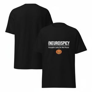May include: A black short-sleeved t-shirt featuring the white text (NEURO)SPICY and Pumpkin Latte For Me Please, accompanied by a small orange jack-o'-lantern graphic with a grinning face centered below the printed text.