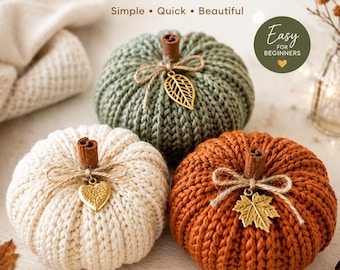 May include: A knitting pattern for a cosy pumpkin featuring three knitted pumpkins in sage green, cream, and burnt orange. Each pumpkin has a cinnamon stick stem, twine bow, and a gold-toned metal charm shaped like a leaf or heart.