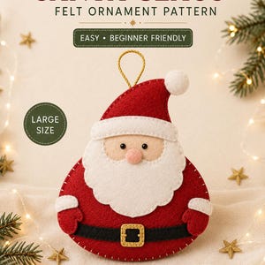 May include: A Santa Claus felt ornament pattern featuring a red and white felt Santa with a black belt and gold buckle. The text reads SANTA CLAUS FELT ORNAMENT PATTERN, EASY BEGINNER FRIENDLY, LARGE SIZE, and Dreamy Yarn Studio. A gold hanging loop is attached.