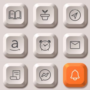 May include: A grid of nine square keyboard keys featuring dark grey icons on white surfaces, except for one orange key. Icons include an open book, a potted plant, a navigation arrow, the Amazon logo, an alarm clock, an envelope, a receipt, a chat bubble, and a bell.