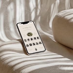 May include: A smartphone displaying a wedding party website template with a cream-colored background. The screen shows the text Our Wedding Party, a circular photo, and a grid of smaller rectangular portraits of individuals in formal attire.