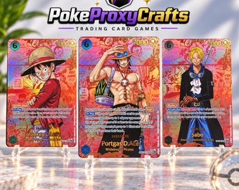 Carte oro del manga One Piece TCG OP-13, i 3 fratelli (proxy create dai fan)