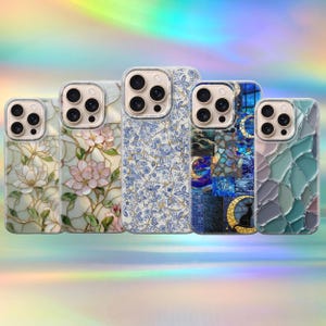 May include: Five smartphone cases arranged in a row, each featuring a distinct design: a white floral pattern, pink blossoms, a blue and white botanical print, a dark blue mosaic with a cat silhouette, and a textured green and gray glass-like pattern.