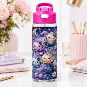 May include: A clear plastic water bottle with a bright pink lid and handle. The body features a vibrant space-themed graphic with stars, a crescent moon, and several cute, smiling dumpling characters resting on small plates and in teacups.
