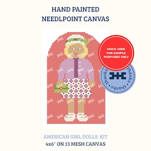 May include: Hand painted needlepoint canvas featuring a doll with blonde hair, a purple cardigan, and a white floral skirt, holding a green clutch. Text reads: HAND PAINTED NEEDLEPOINT CANVAS, AMERICAN GIRL DOLLS: KIT, 4x6" ON 13 MESH CANVAS.