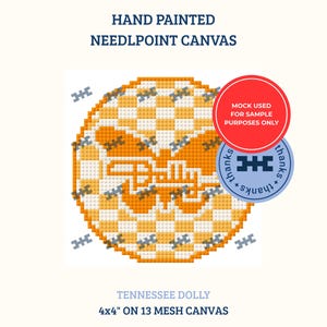 May include: A hand painted needlepoint canvas titled Tennessee Dolly, measuring 4x4 inches on 13 mesh canvas. The design features a circular orange and white checkered pattern with a central orange butterfly graphic and small grey butterfly icons.