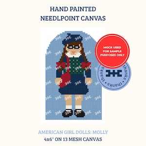 May include: A hand painted needlepoint canvas featuring a pixelated illustration of a doll named Molly. The doll wears a blue beret, a green and blue plaid sweater, a dark blue skirt, and black shoes. Text reads: HAND PAINTED NEEDLEPOINT CANVAS, AMERICAN GIRL DOLLS: MOLLY, 4x6" ON 13 MESH CANVAS.