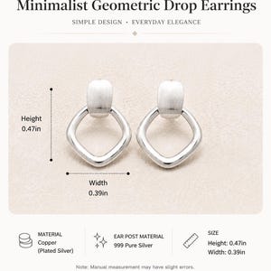 May include: A pair of silver-colored drop earrings featuring a smooth, rounded rectangular top piece connected to a diamond-shaped open frame. The earrings have a height of 0.47 inches and a width of 0.39 inches as indicated by the measurement labels.
