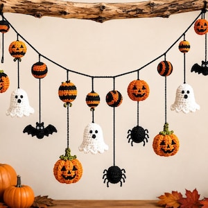 May include: A Halloween-themed crochet garland featuring orange jack-o'-lanterns, white ghosts, black bats, black spiders, and striped spheres. The crocheted figures are suspended from a black yarn string, creating a festive seasonal decoration.