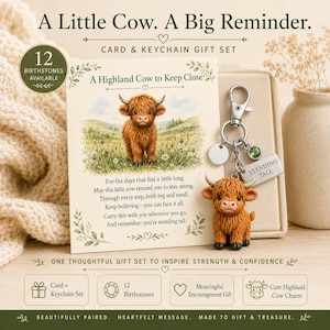 May include: A gift set featuring a greeting card with a Highland cow illustration and a poem, paired with a metal keychain featuring a small brown Highland cow charm, a green birthstone, and a rectangular tag engraved with the text STANDING TALL.