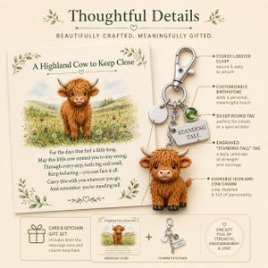 May include: A Highland cow keychain gift set featuring a silver lobster clasp, a green birthstone, a blank silver round tag, and a rectangular tag engraved with the text STANDING TALL. Includes a message card titled A Highland Cow to Keep Close.