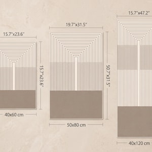 May include: Three rectangular wall art prints featuring a beige background with a pattern of thin brown lines forming nested arch shapes above a solid brown rectangular block. Dimensions are 15.7"x23.6", 19.7"x31.5", and 15.7"x47.2".