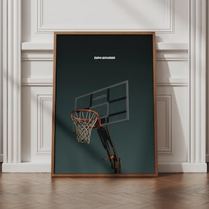 May include: A framed wall art print featuring a dark green background with a basketball hoop and backboard. The text 'ZERO EXCUSES' is printed in white above the hoop. The basketball hoop has an orange rim and a white net.