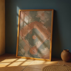 May include: A framed wall art print featuring an aerial view of a baseball field rendered in a painterly style with muted green and terracotta tones. The artwork depicts the diamond, bases, and players in a soft, textured brushstroke aesthetic.